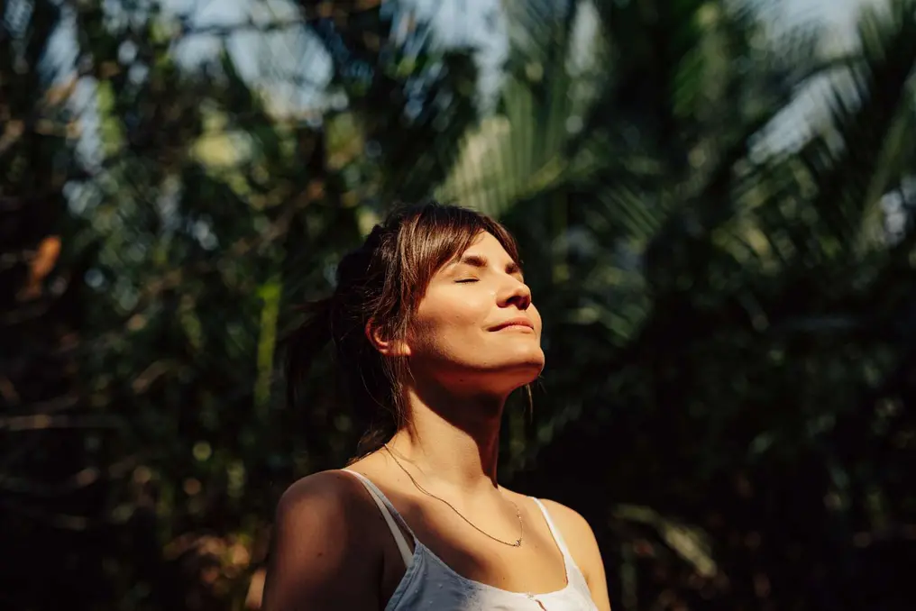 Woman enjoying the sun outside