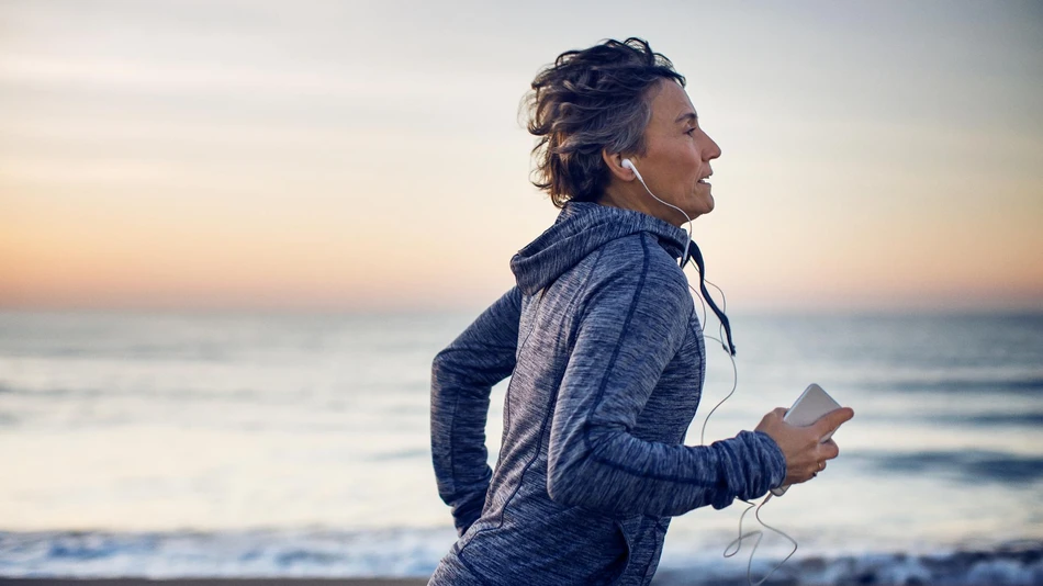 Woman running by the sea