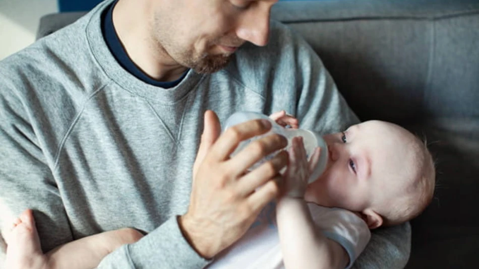 Dad feeding baby
