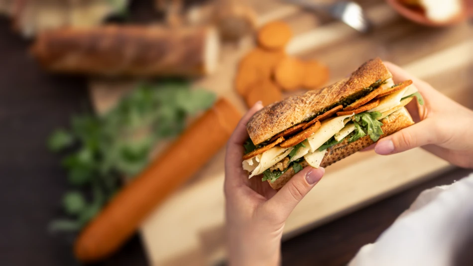 Plant-based salami in a baguette sandwich with cheese and rocket