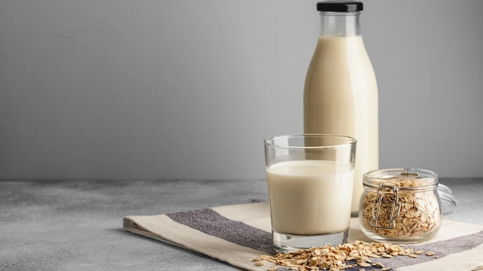 Enzymes to build better oat drinks - cup of oat milk and oats