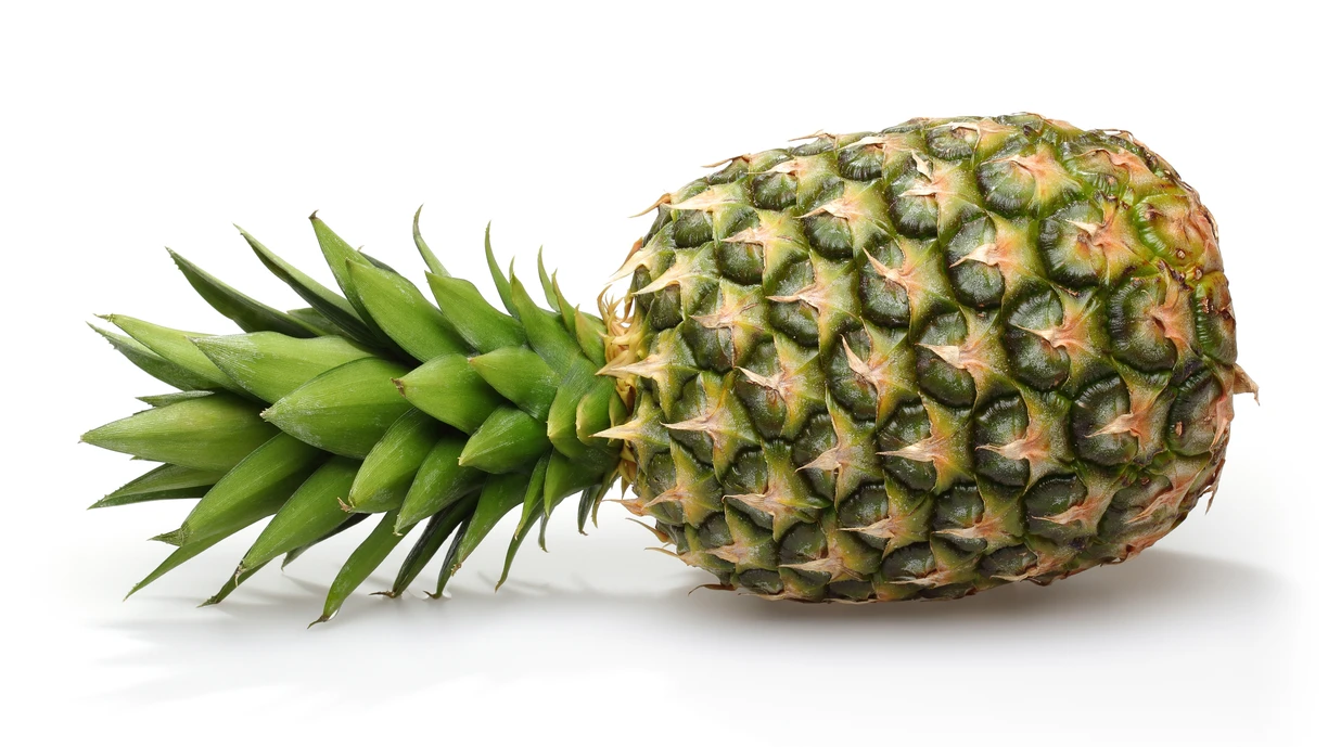 A whole pineapple isolated on a white background 