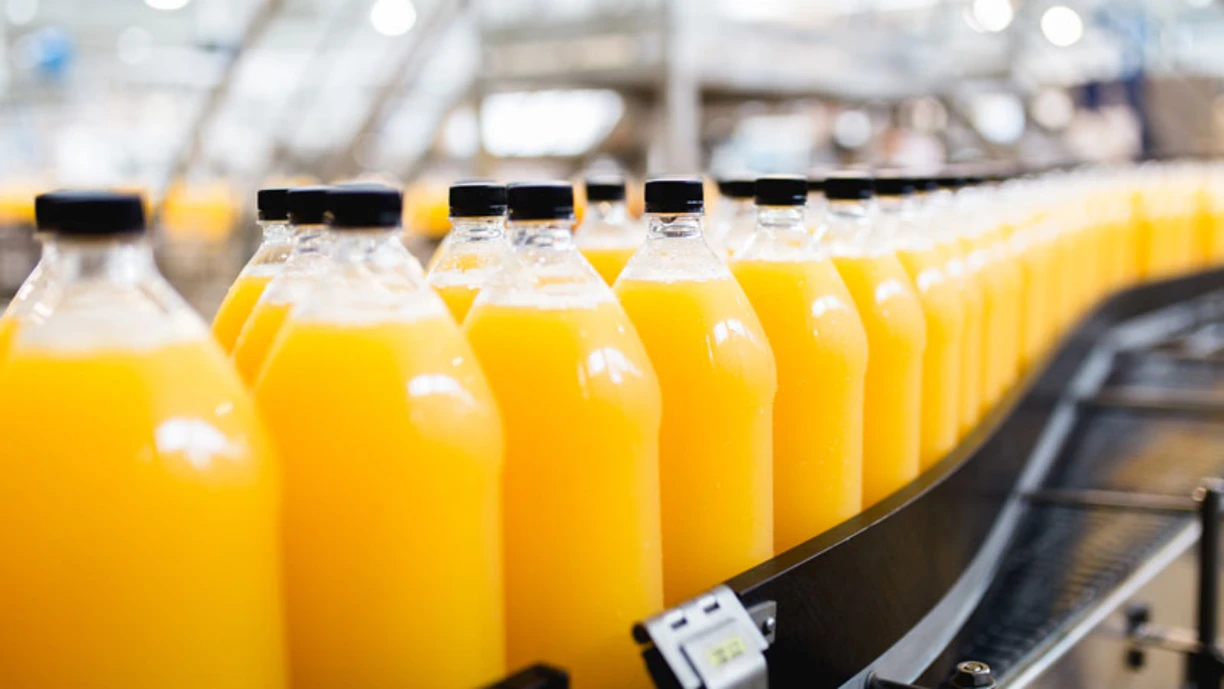 Orange juice on a conveyor belt