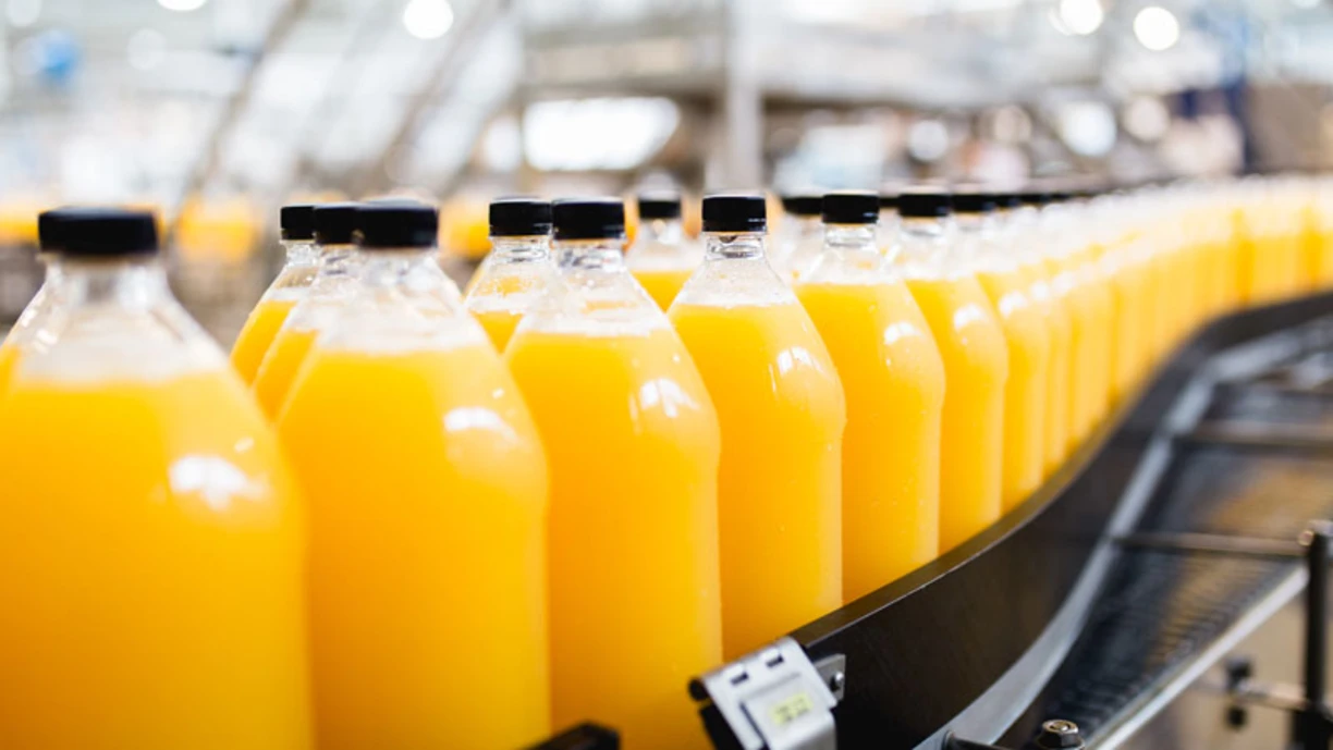 Orange juice on a conveyor belt