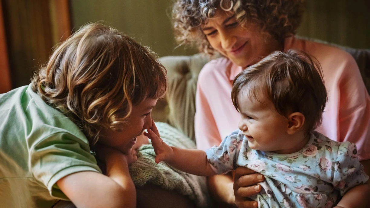 family playing on sofa 
