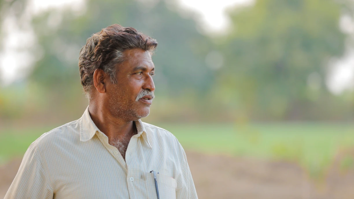 Farmer_looking_at_his_soil