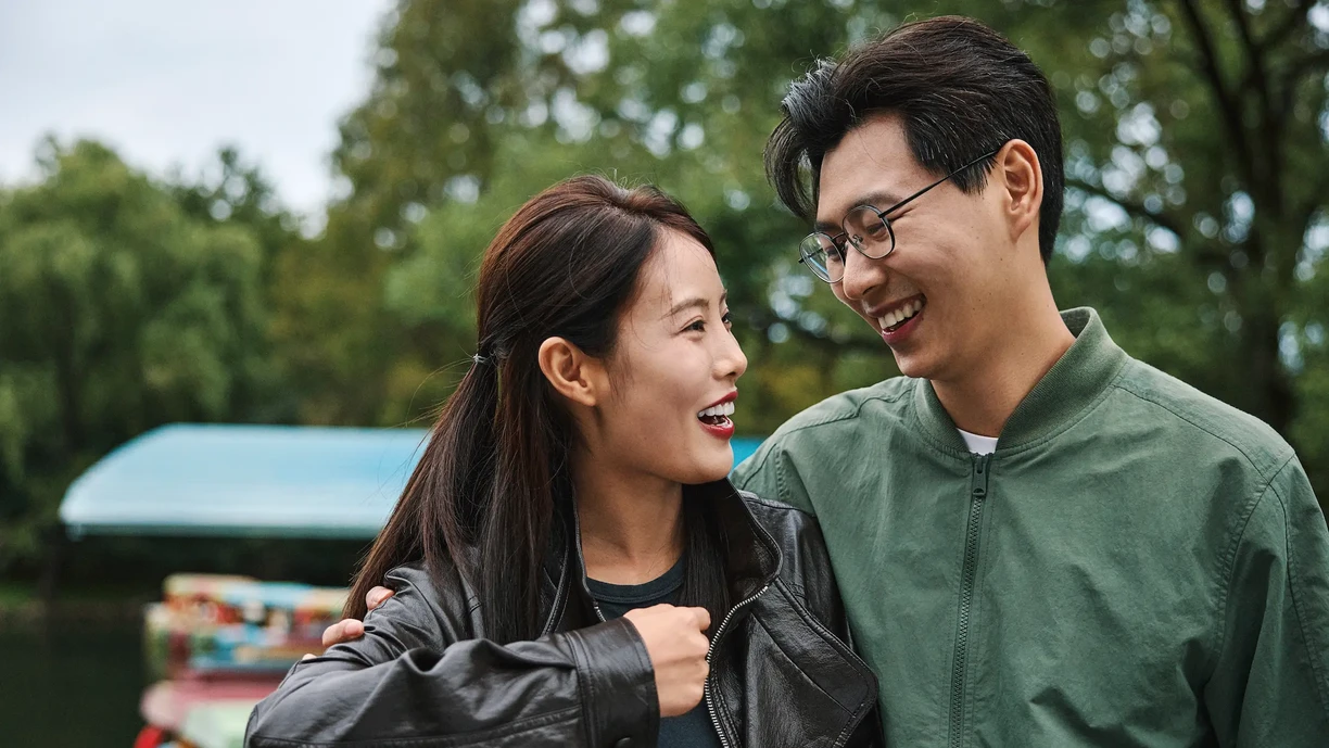 Couple laughing and walking