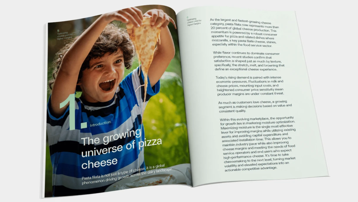 Open whitepaper spread featuring a full-page photograph of a boy stretching a slice of pizza cheese on the left page alongside the chapter title “The growing universe of pizza cheese.