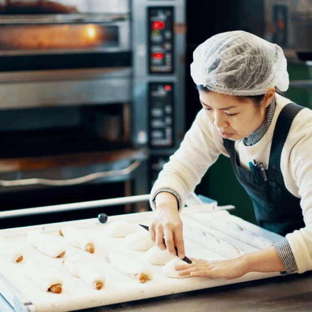 Woman preparing buns 