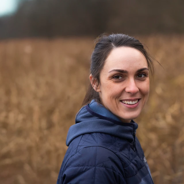 Brunette girl smiling towards the camera