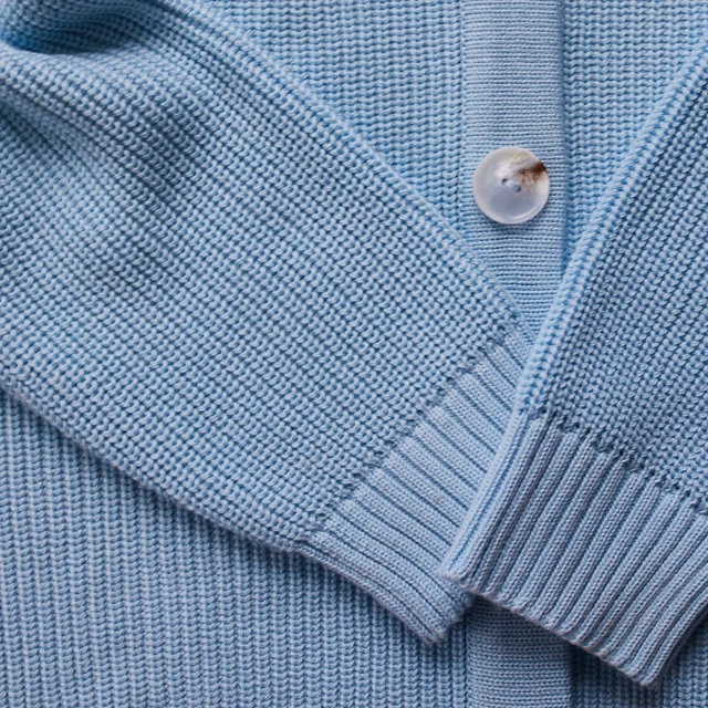 button of a blue jumper