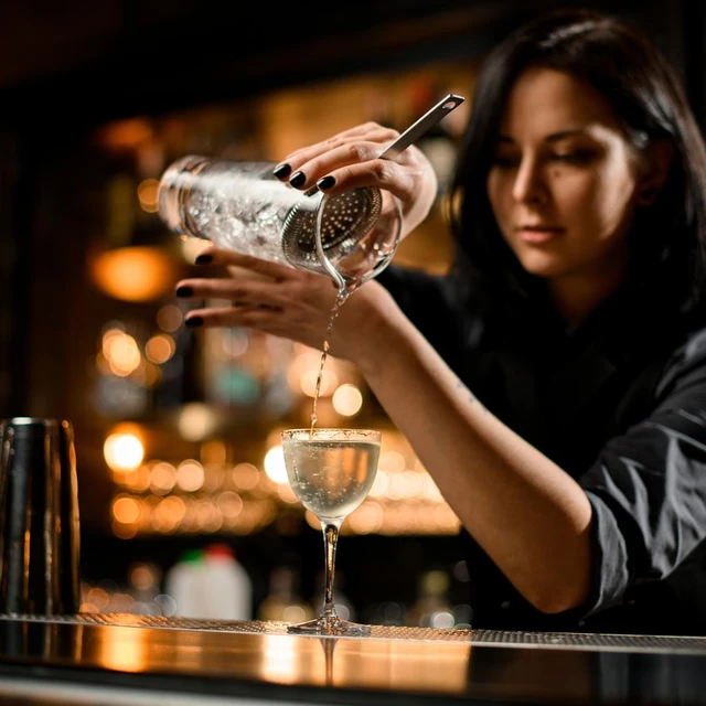 bartender girl making a cocktail