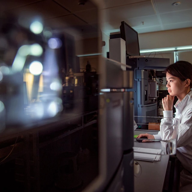 scientist looking at computer