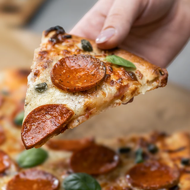 Hand-picking-pizza-up
