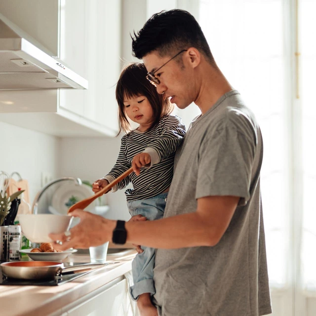 father and daughter cooking