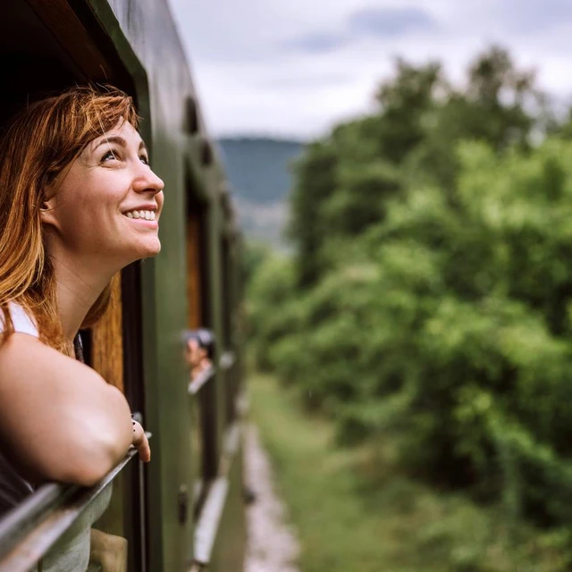 Woman smiling on train