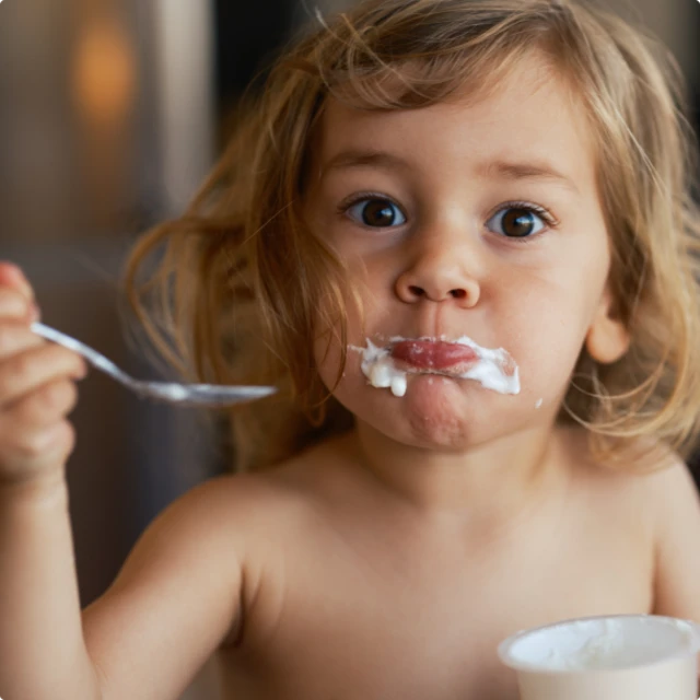 Girl eating yogurt