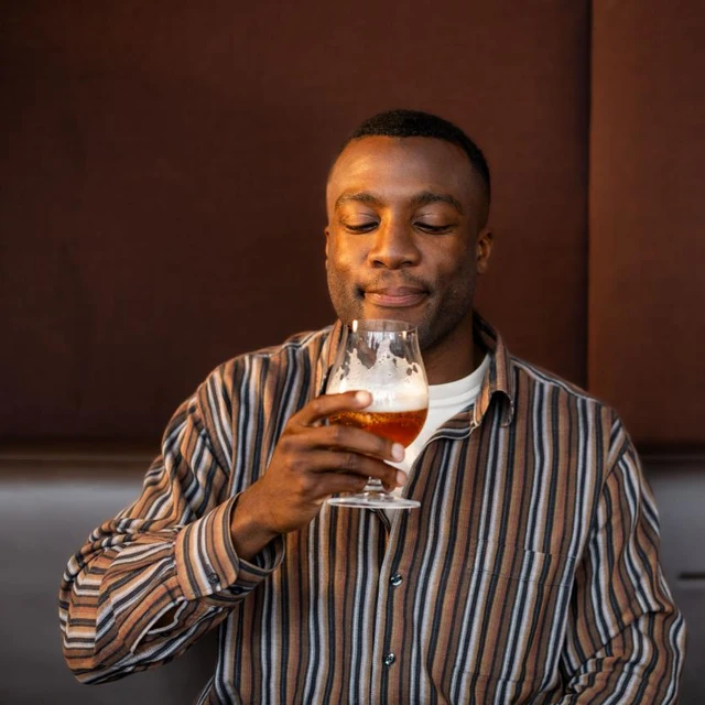 man enjoying beer