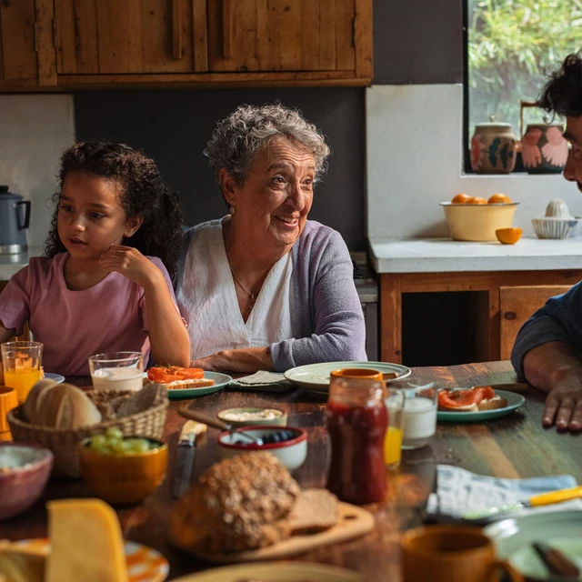 family-eating-smoked-salmon-in-kitchen-novonesis