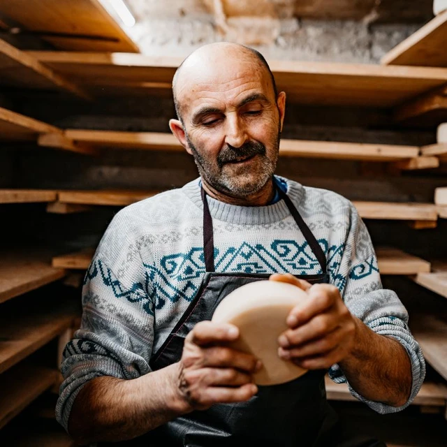 man with aged cheese