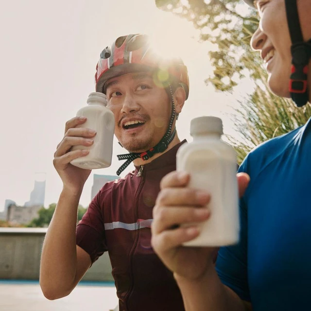 Fermented milk production end product two people cycling eating fermented milk