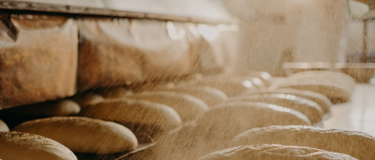 Flour poured on loaves of bread