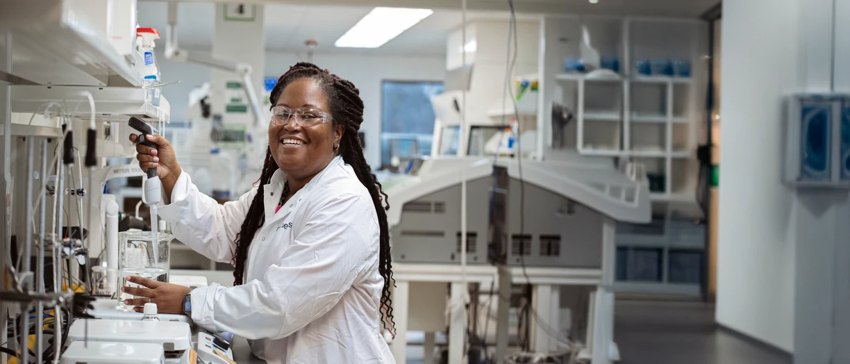 Girl smiling to camera in lab