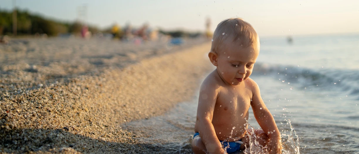 Healthy baby on beach