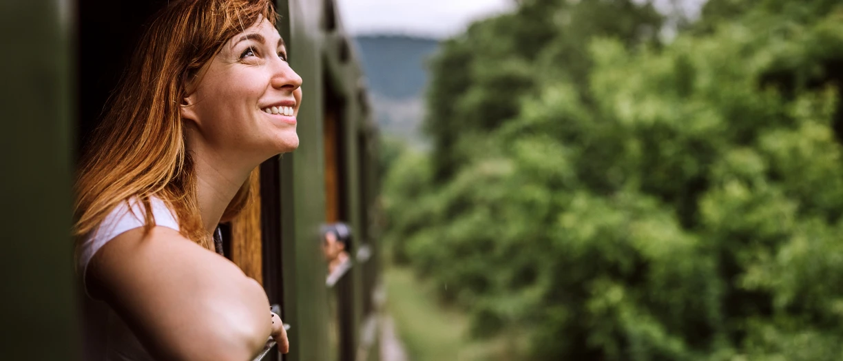 woman looking out of train window