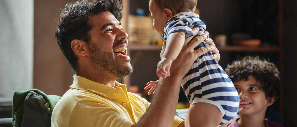 dad playing with baby