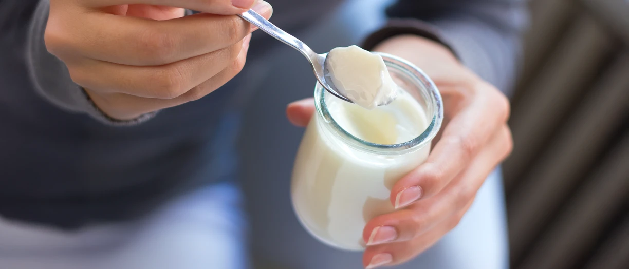 woman eating yogurt