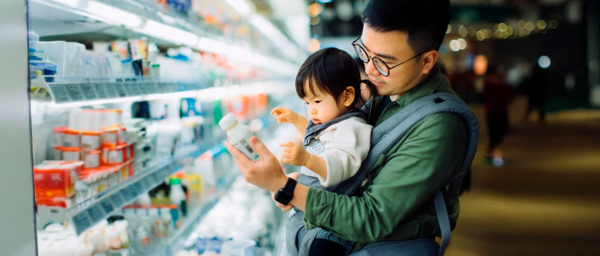 father and daughter shopping for dairy products