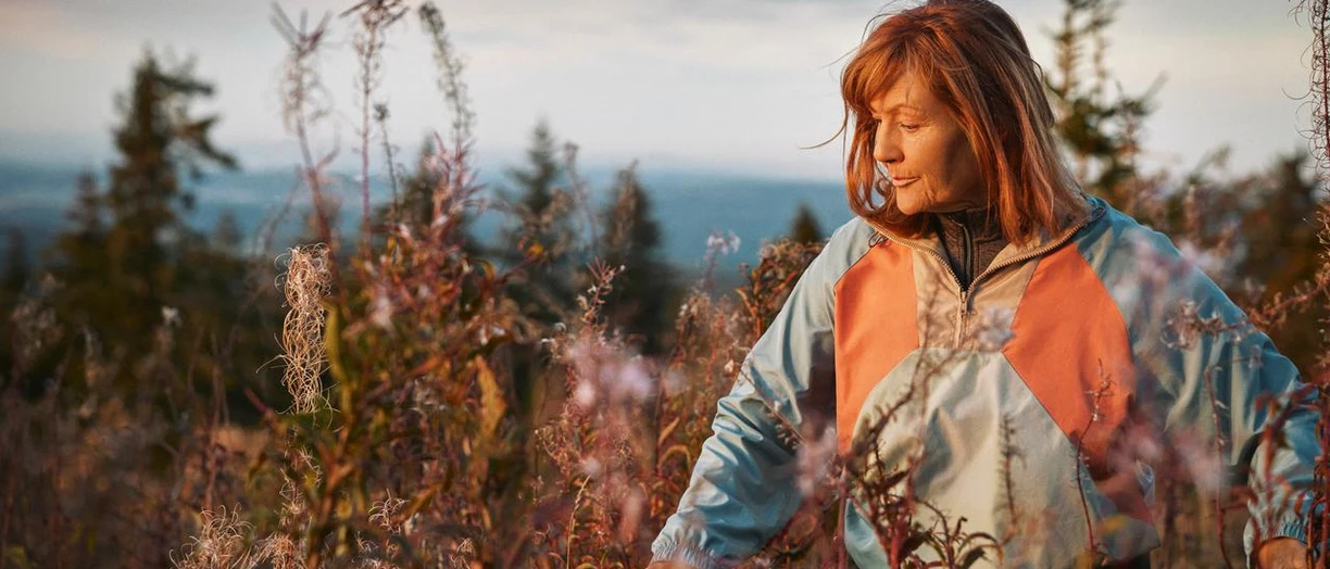 woman walking in meadow