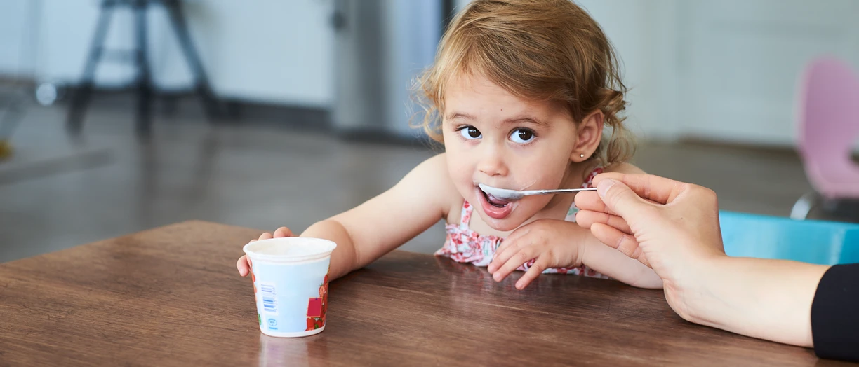 Girl eating yogurt