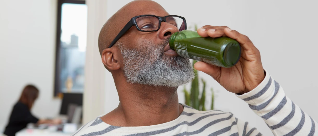 Man drinking smoothie
