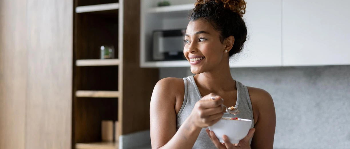 woman eating yogurt fitness