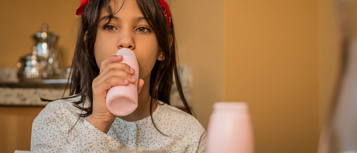Girl drinking yogurt