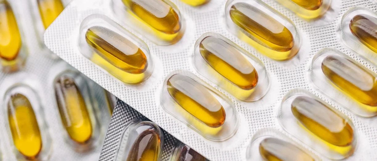 A closeup of fish oil pill