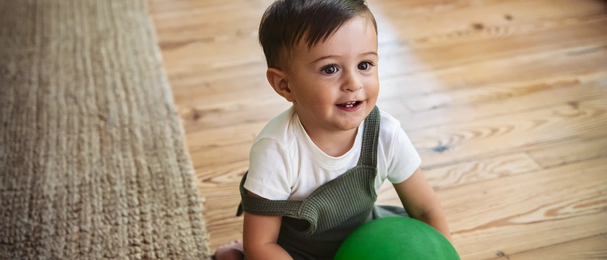 toddler-boy-ball-floor-001-