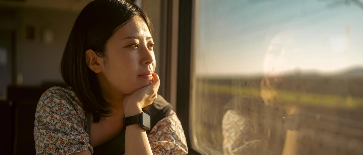 pensive mother on train