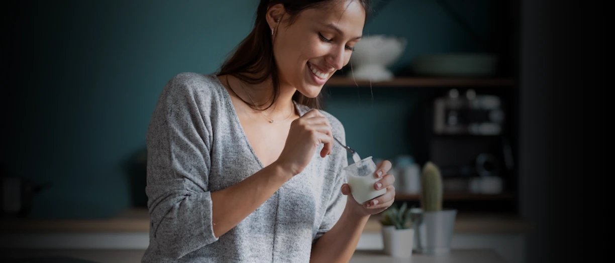 woman eating yogurt