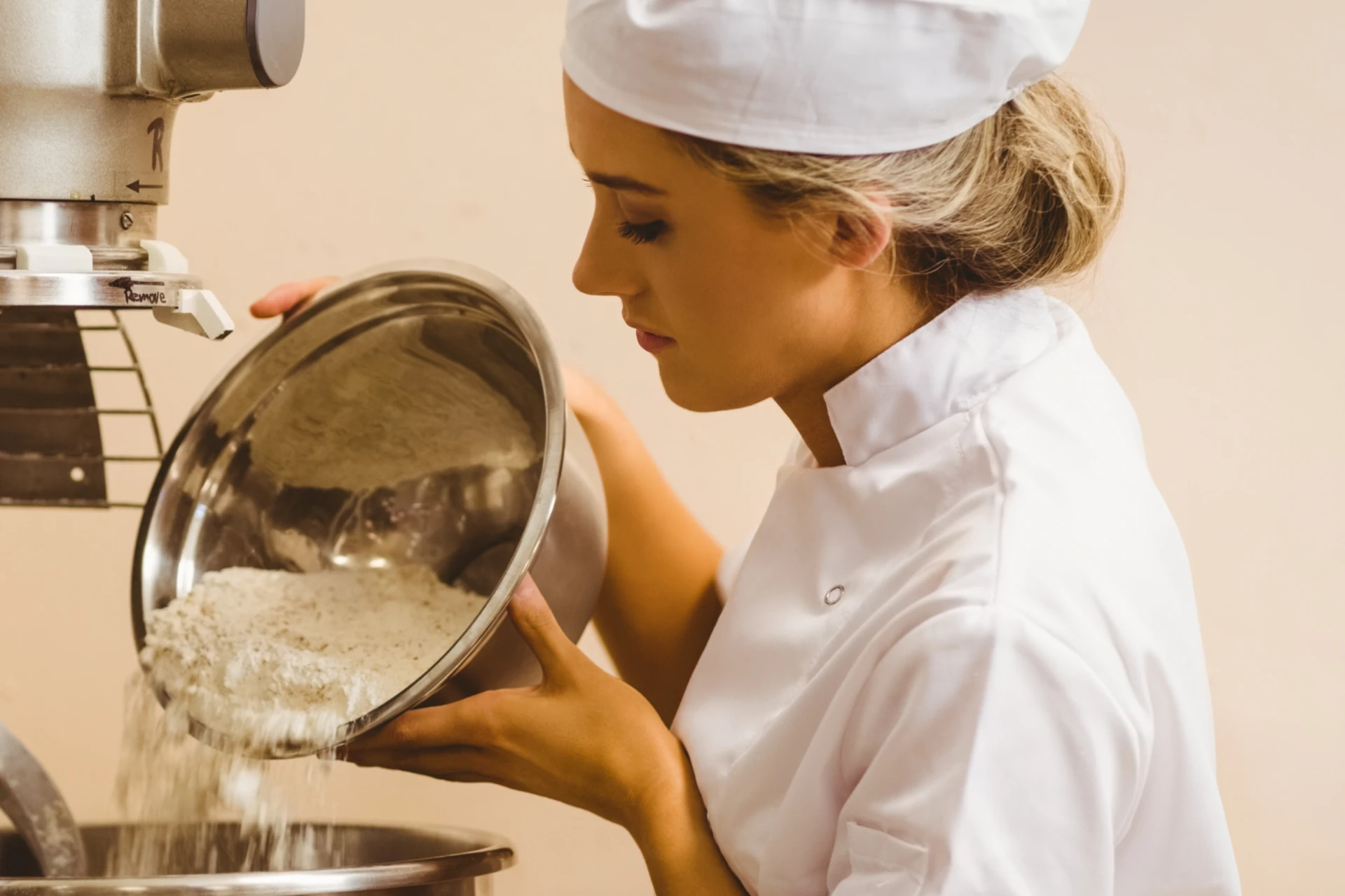 Woman in factory folding dough