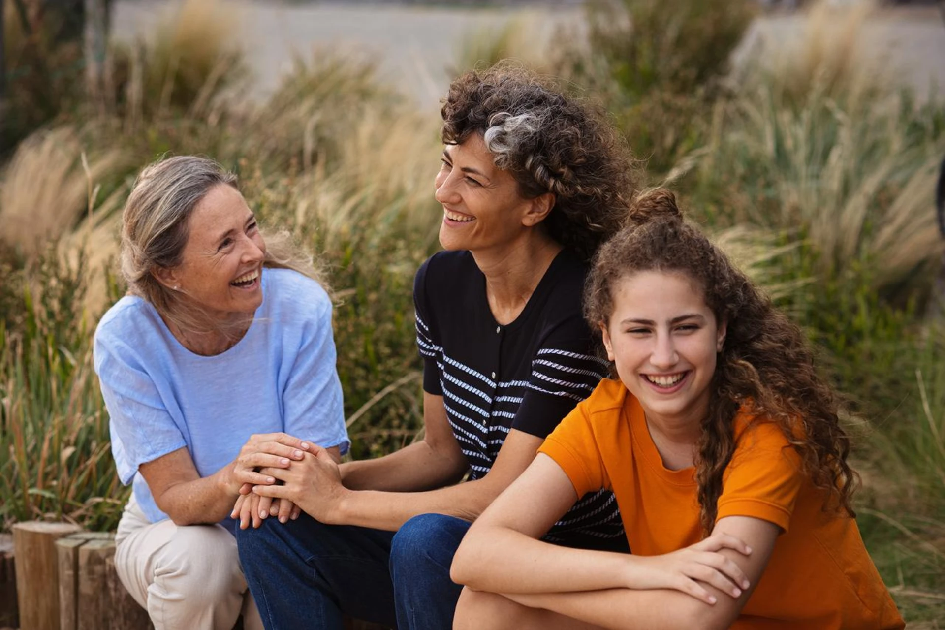 Family laughing at beach