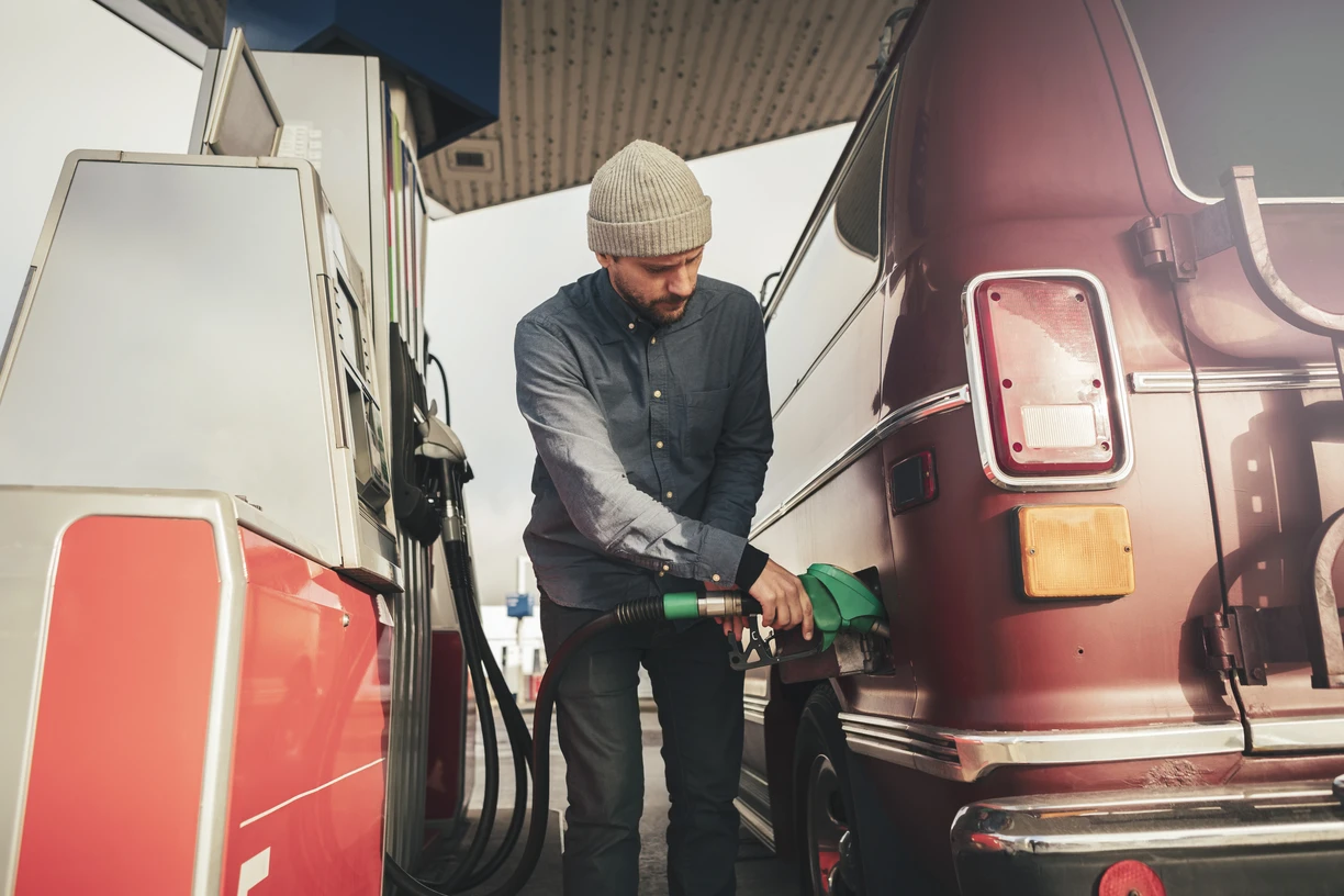 Man at gas station pumping biodiese