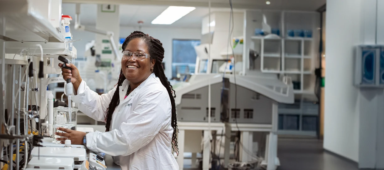 Girl smiling to camera in lab