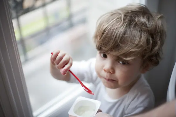 Boy enjoying yogurt