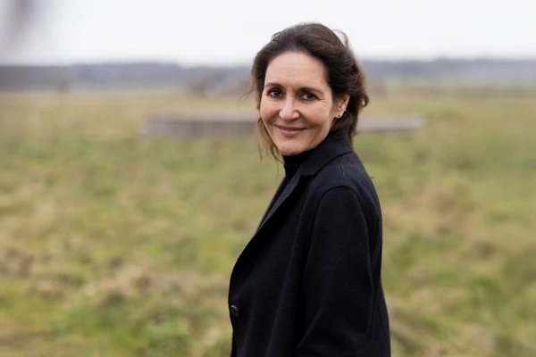 Woman in a colorful shirt with a black blazer