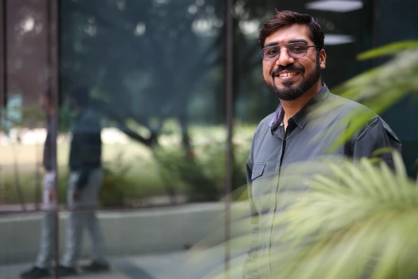 Guy smiling to camera in nature