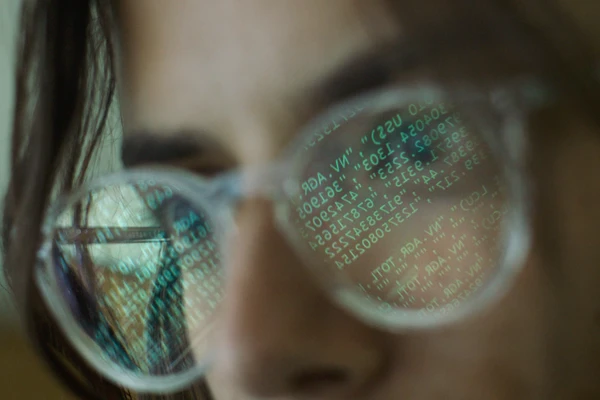 Code reflecting in glasses