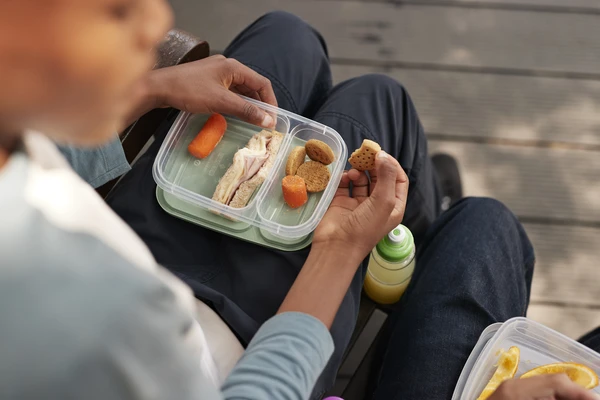 Boy sitting with lunch box